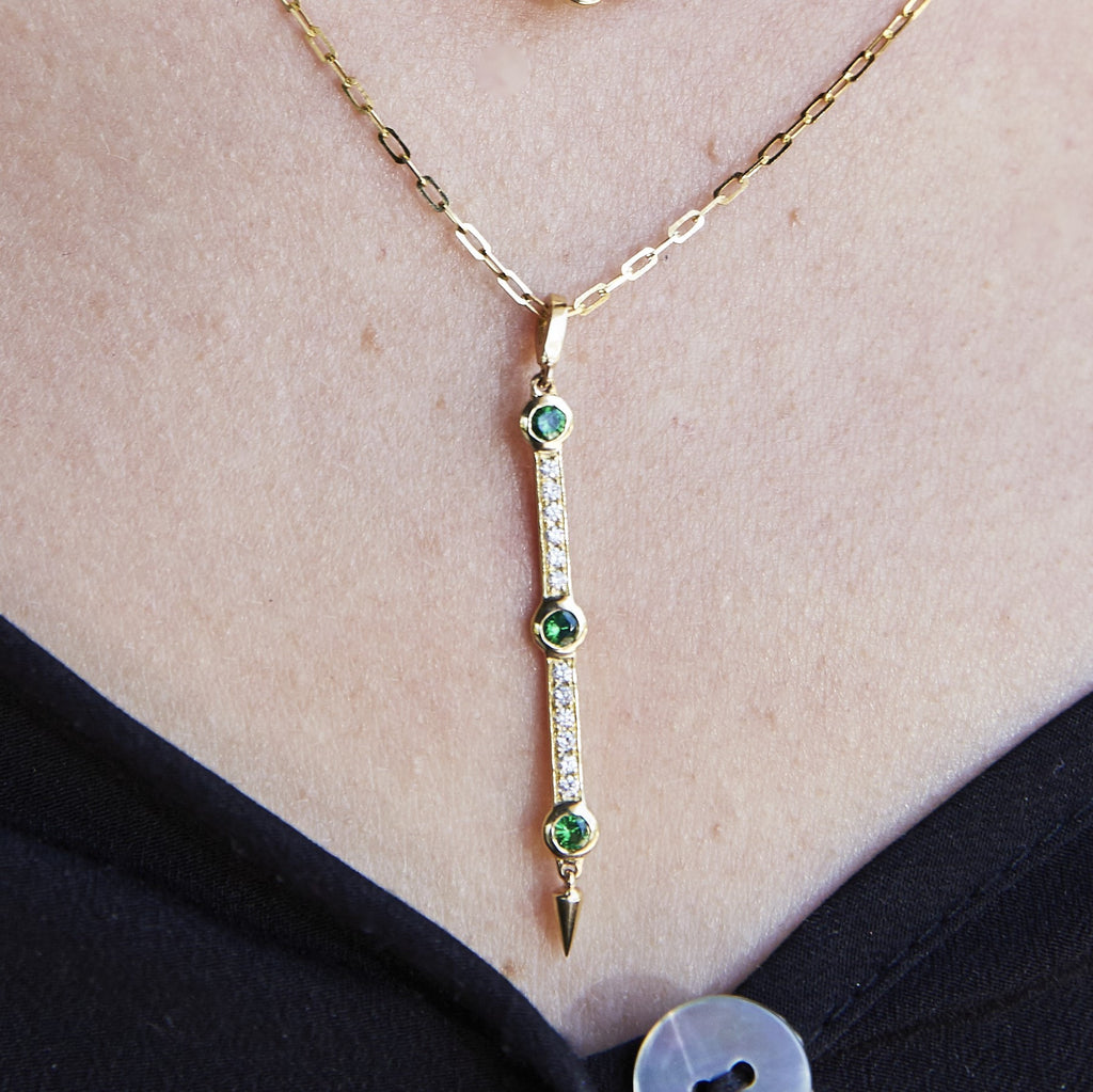 Diamond and Tsavorite Garnet Bar Pendant Necklace With Spike in Yellow Gold Model Closeup By Irthly