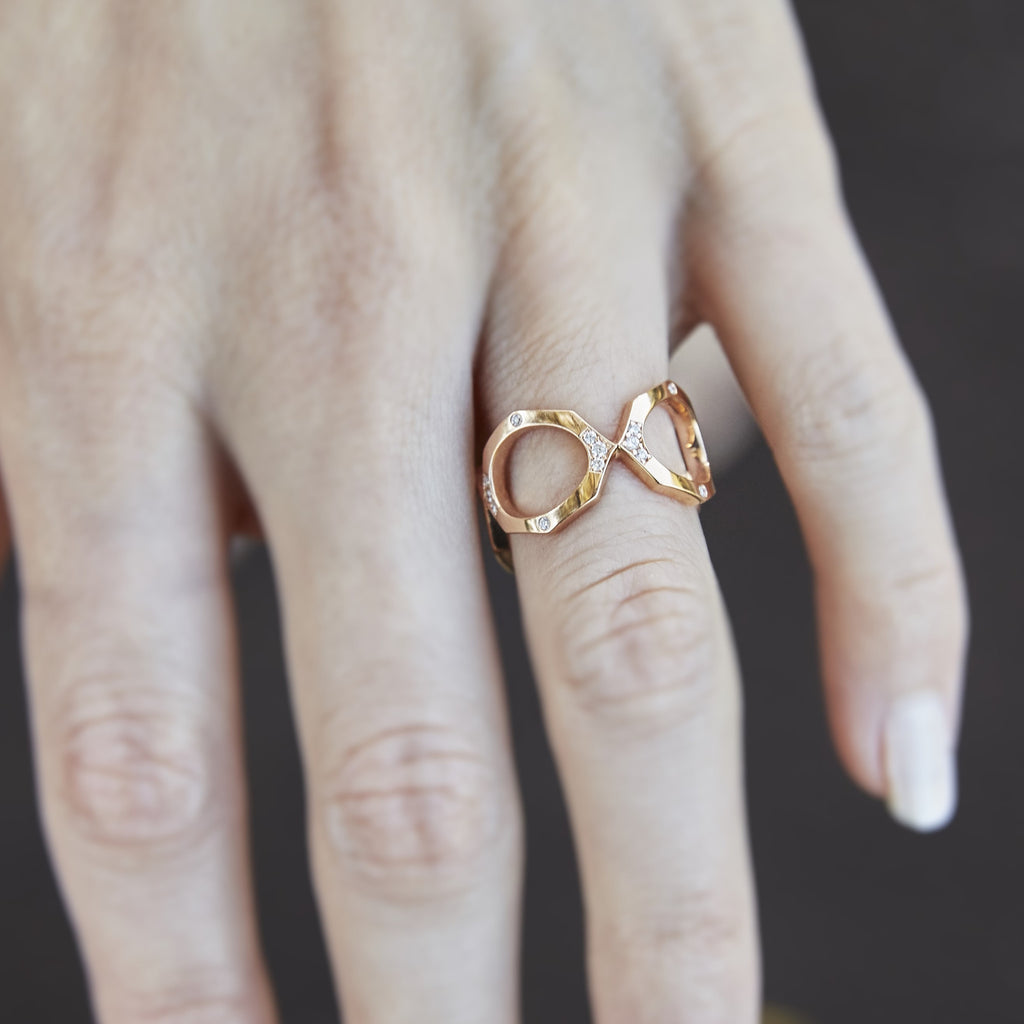 Diamond Eternity Ring Band in Rose Gold Displayed in Hand By Irthly