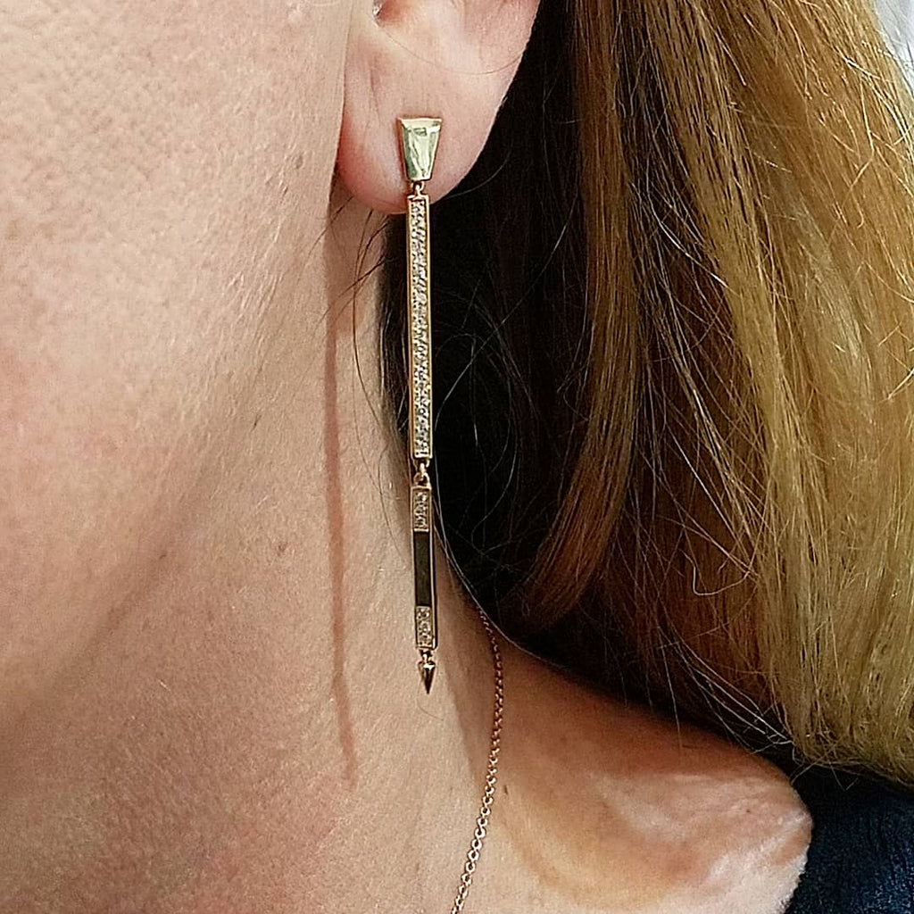two tier bar drop earrings in yellow gold on ear of model | Irthly Sans | Irthly